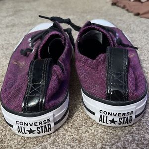 Purple converse with a hornet.